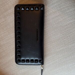 Black Valentino Continental Wallet with black studs and gold zipper